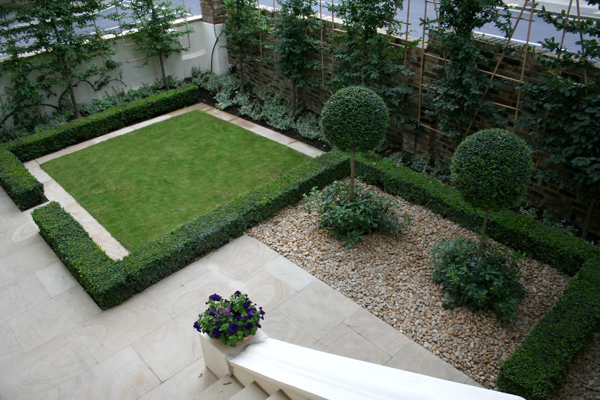 Contemporary garden with formal planting design and resin bonded gravel